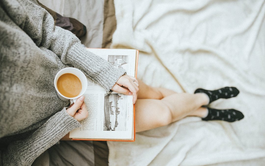 reading a book with a coffee